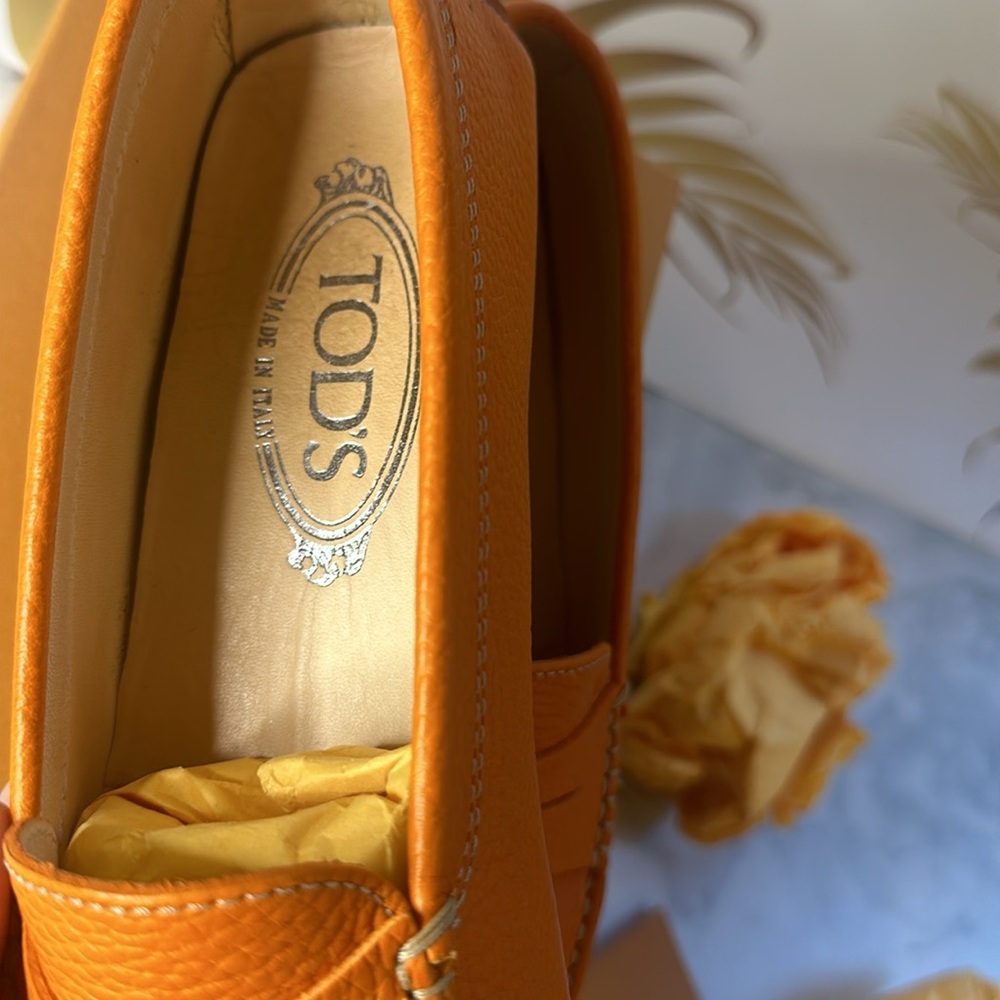 Authentic Tod’s flat, in Hermes’ orange.